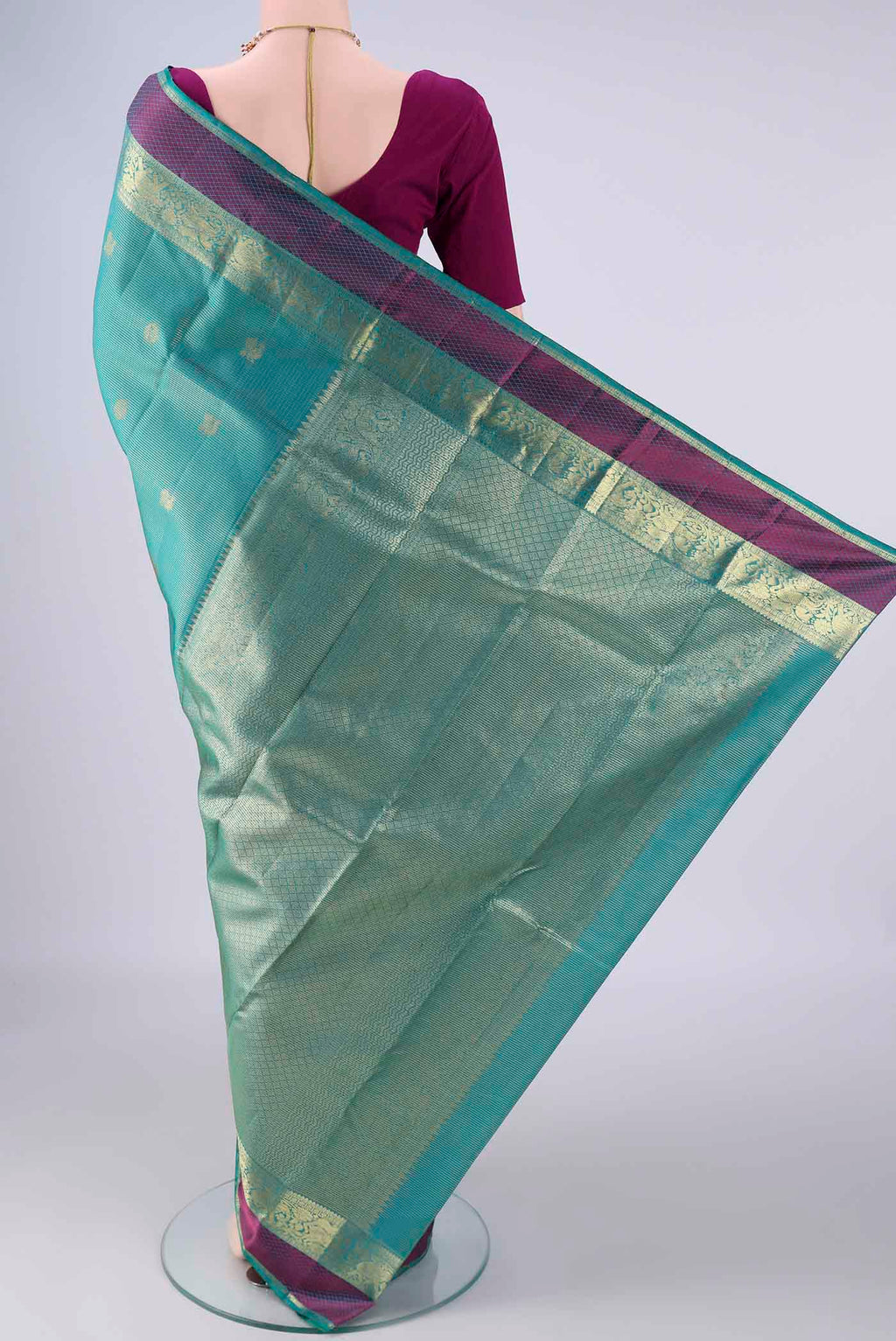 Flat view of Sea Green Kanjivaram Silk Saree with Checked design on the body and Zari And Thread Border. 