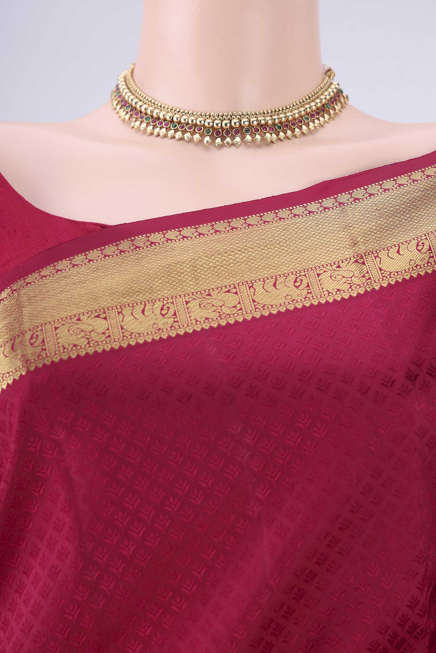Border image of Dark Pink Kanjivaram Silk Saree with Jacquard design on the body and Zari Border. 