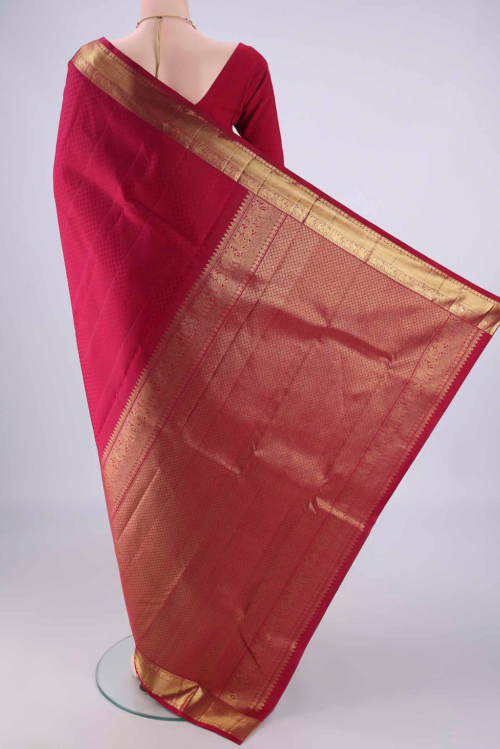 Flat view of Dark Pink Kanjivaram Silk Saree with Jacquard design on the body and Zari Border. 