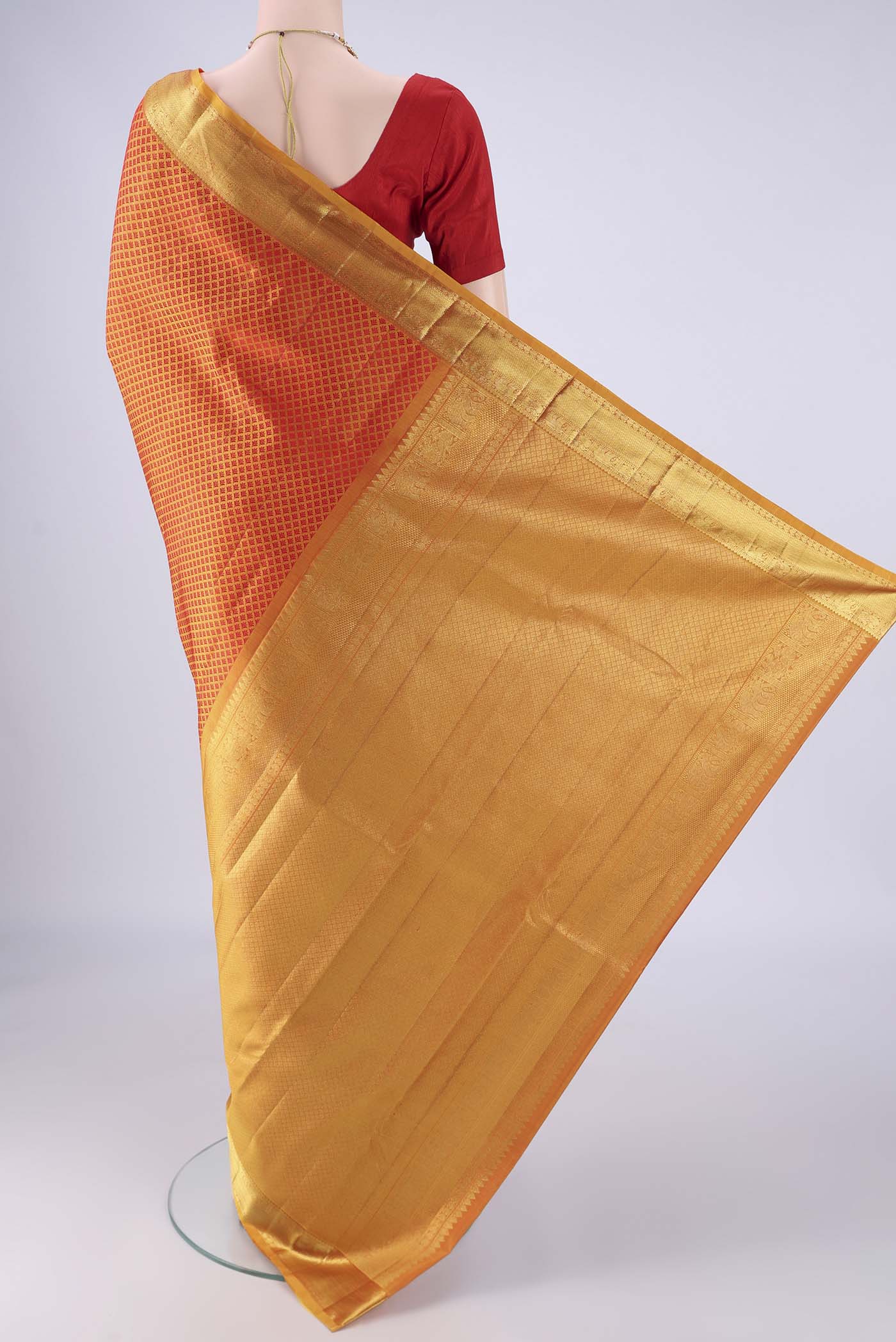 Flat view of Mustard Kanjivaram Silk Saree with Jacquard design on the body and Zari Border. 