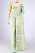 Mint Green Kanjivaram Silk Saree with Jacquard design on the body and Zari Border.  displayed on a mannequin