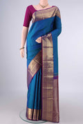 Pure Silk Peacock Blue Kanjivaram Saree with Jacquard design on the body and Zari Border.  displayed on a mannequin