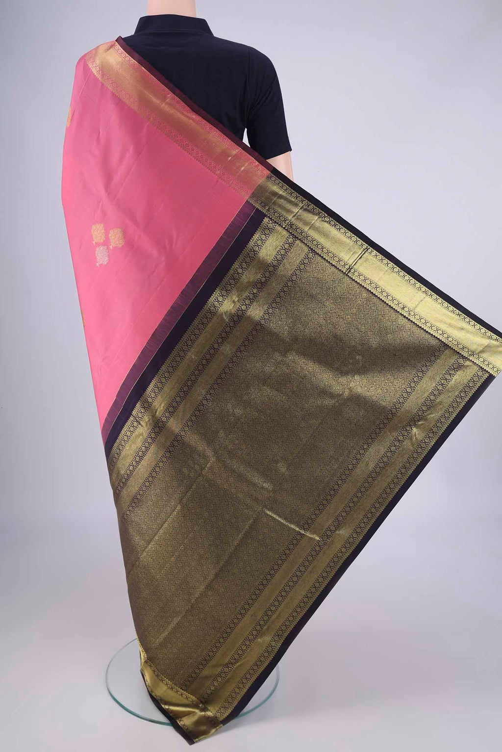 Flat view of Rose pink Kanchipuram Silk Saree with Zari Butta on the body and Zari Border. 