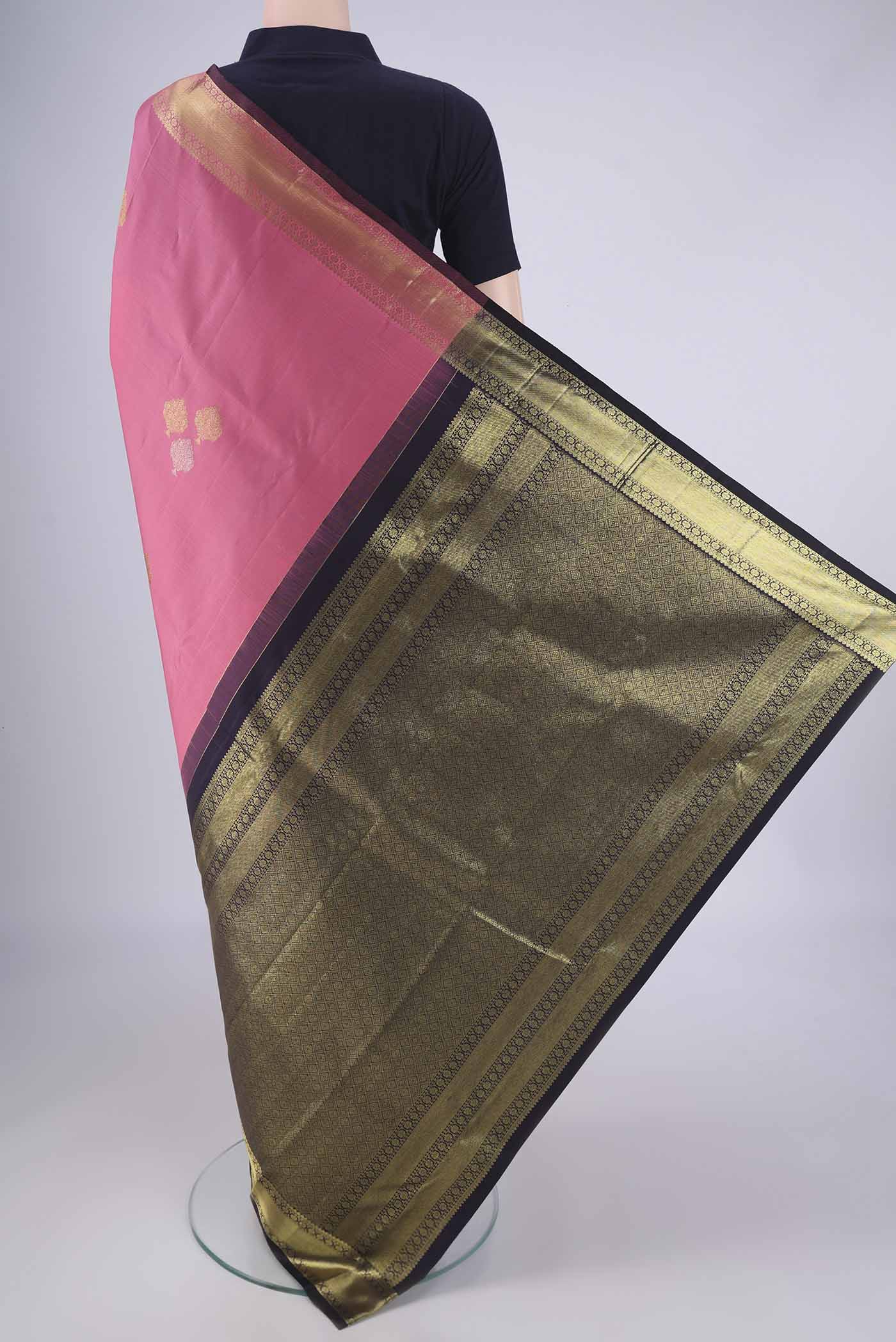 Flat view of Rose pink Kanchipuram Silk Saree with Zari Butta on the body and Zari Border. 