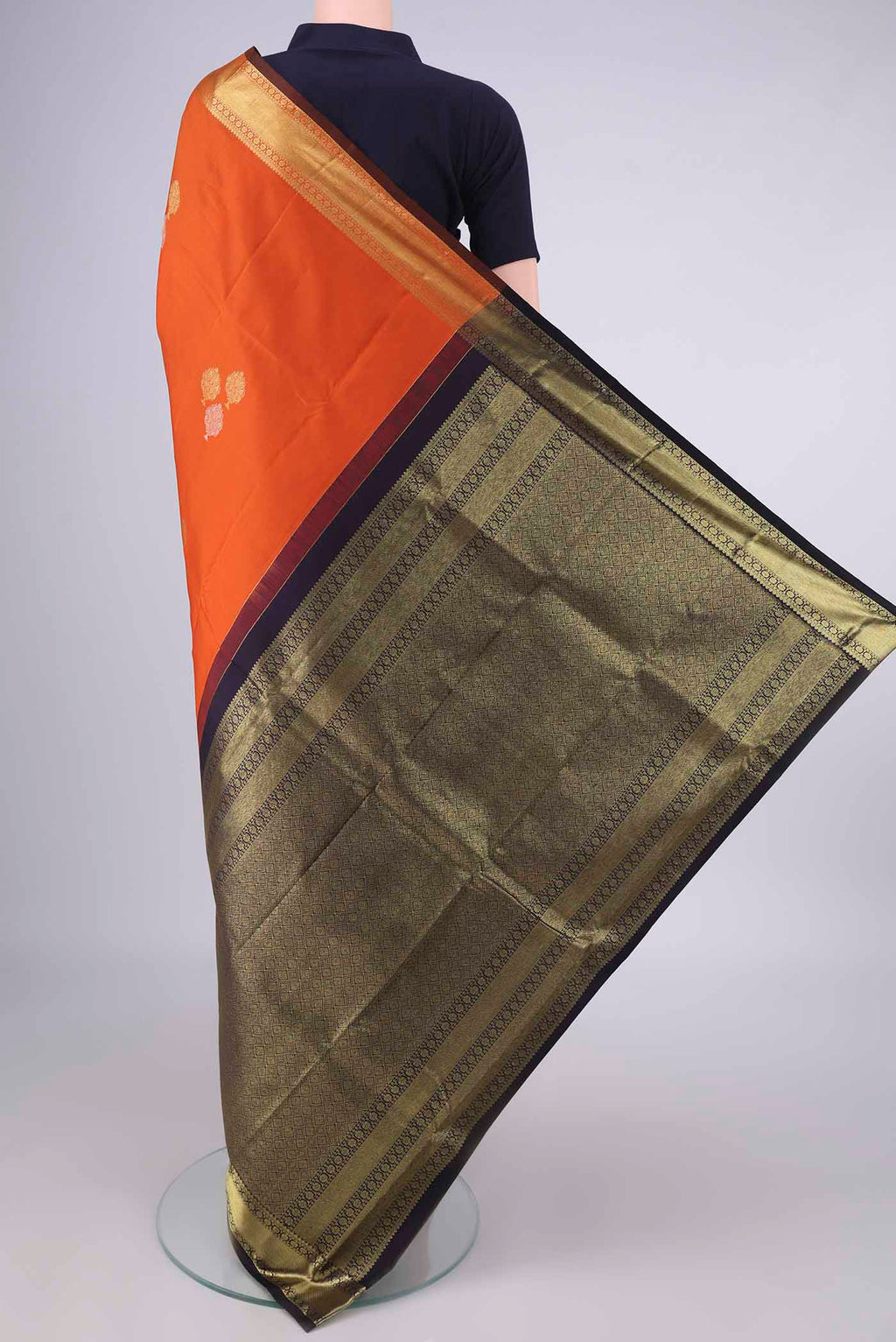 Flat view of Pure Silk Orange Kanchipuram Saree with Zari Butta on the body and Zari Border. 