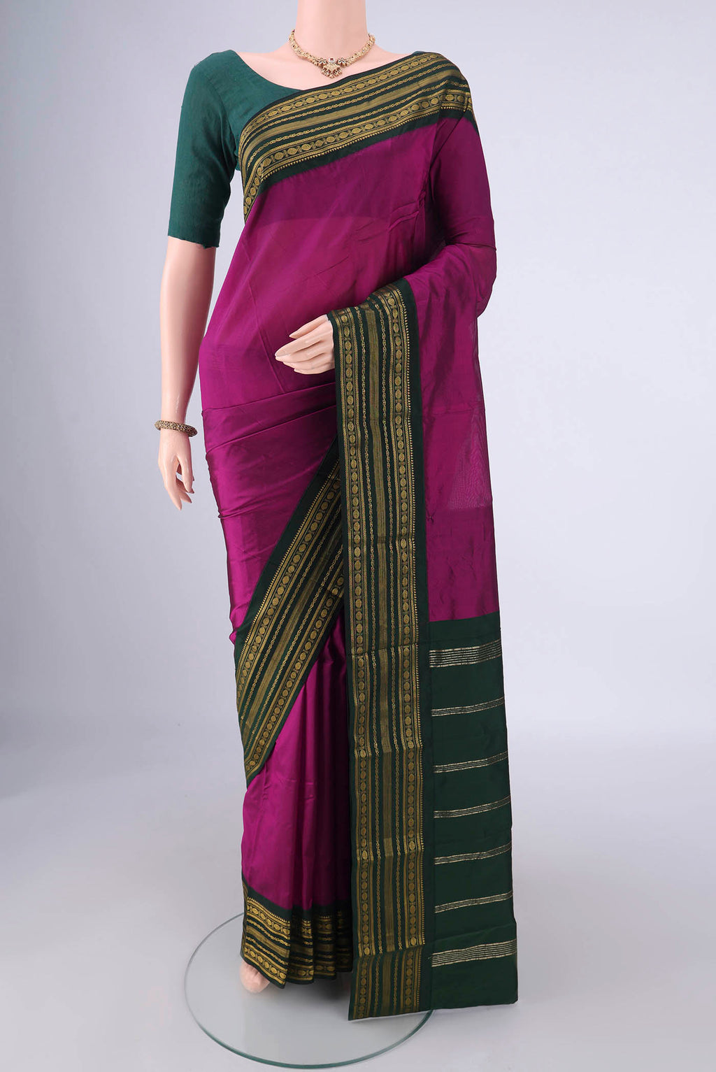 Magenta Blended Bangalore Silk Saree with Plain Body and Zari Border.  displayed on a mannequin