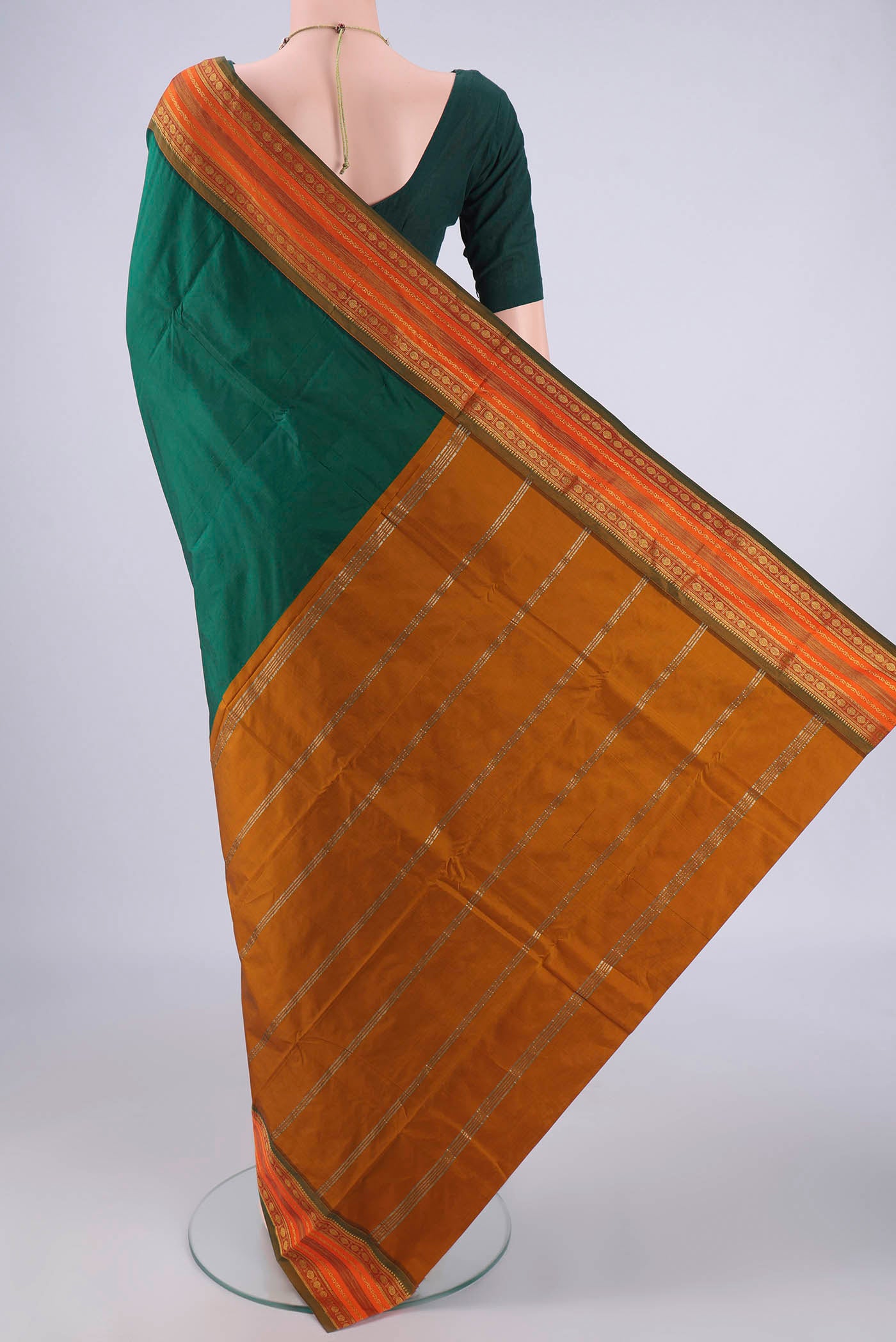 Flat view of Bottle Green Blended Bangalore Silk Saree with Plain Body and Zari Border. 