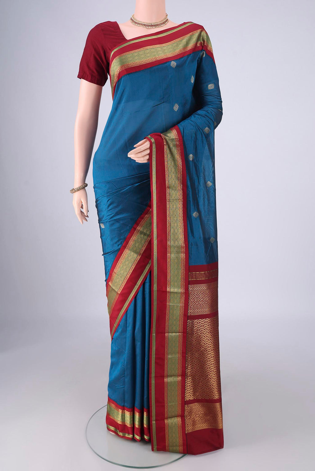 Dark Blue Blended Bangalore Silk Saree with Zari Butta on the body and Zari Border.  displayed on a mannequin