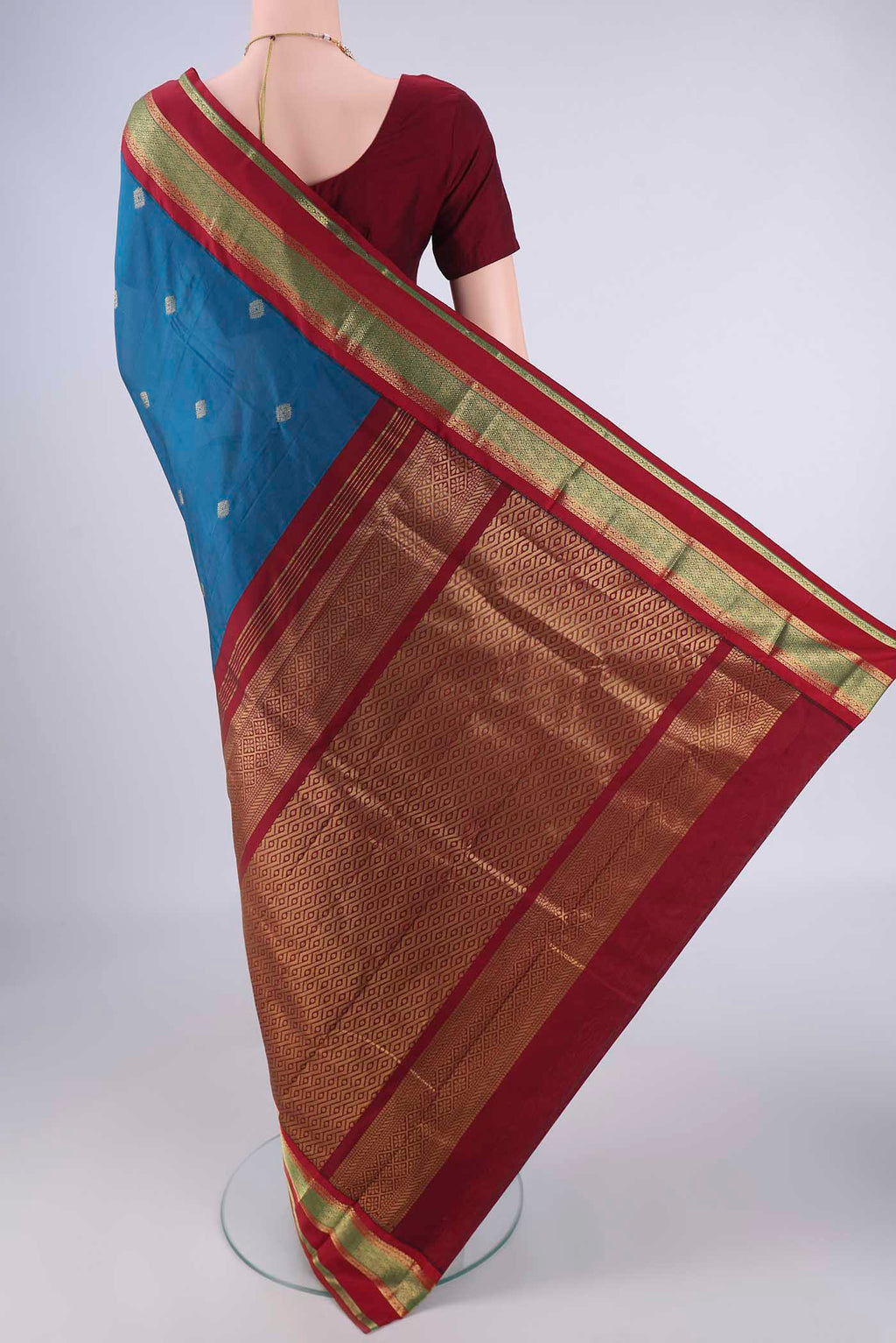 Flat view of Dark Blue Blended Bangalore Silk Saree with Zari Butta on the body and Zari Border. 