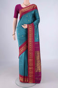 Maya Blue Blended Bangalore Silk Saree with Zari Butta on the body and Temple Border.  displayed on a mannequin