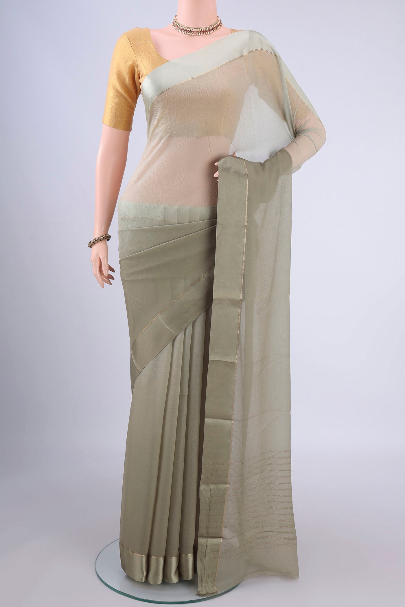 Grey Mysore Chiffon Saree with Plain Body and Plain Border.  displayed on a mannequin