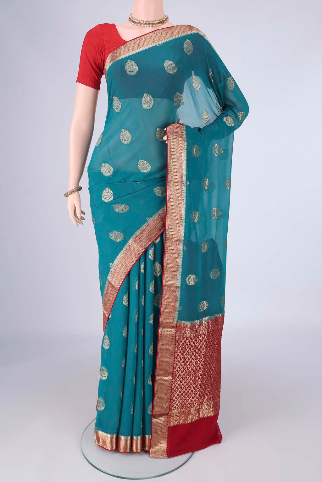 Blue Mysore Georgette Saree with Zari Butta on the body and Zari Border.  displayed on a mannequin