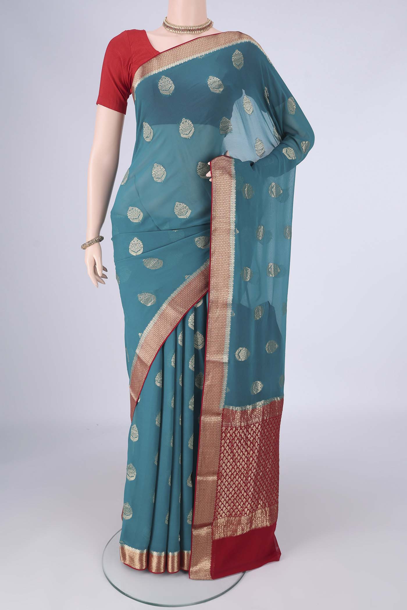 Blue Mysore Georgette Saree with Zari Butta on the body and Zari Border.  displayed on a mannequin