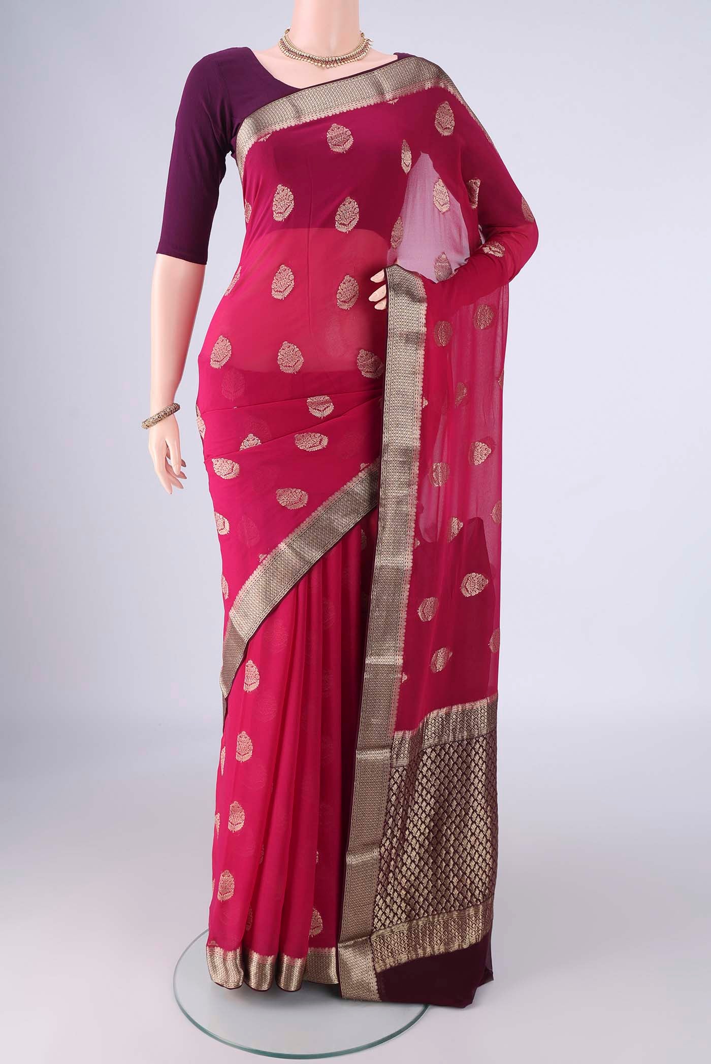 Pink Mysore Georgette Saree with Zari Butta on the body and Zari Border.  displayed on a mannequin