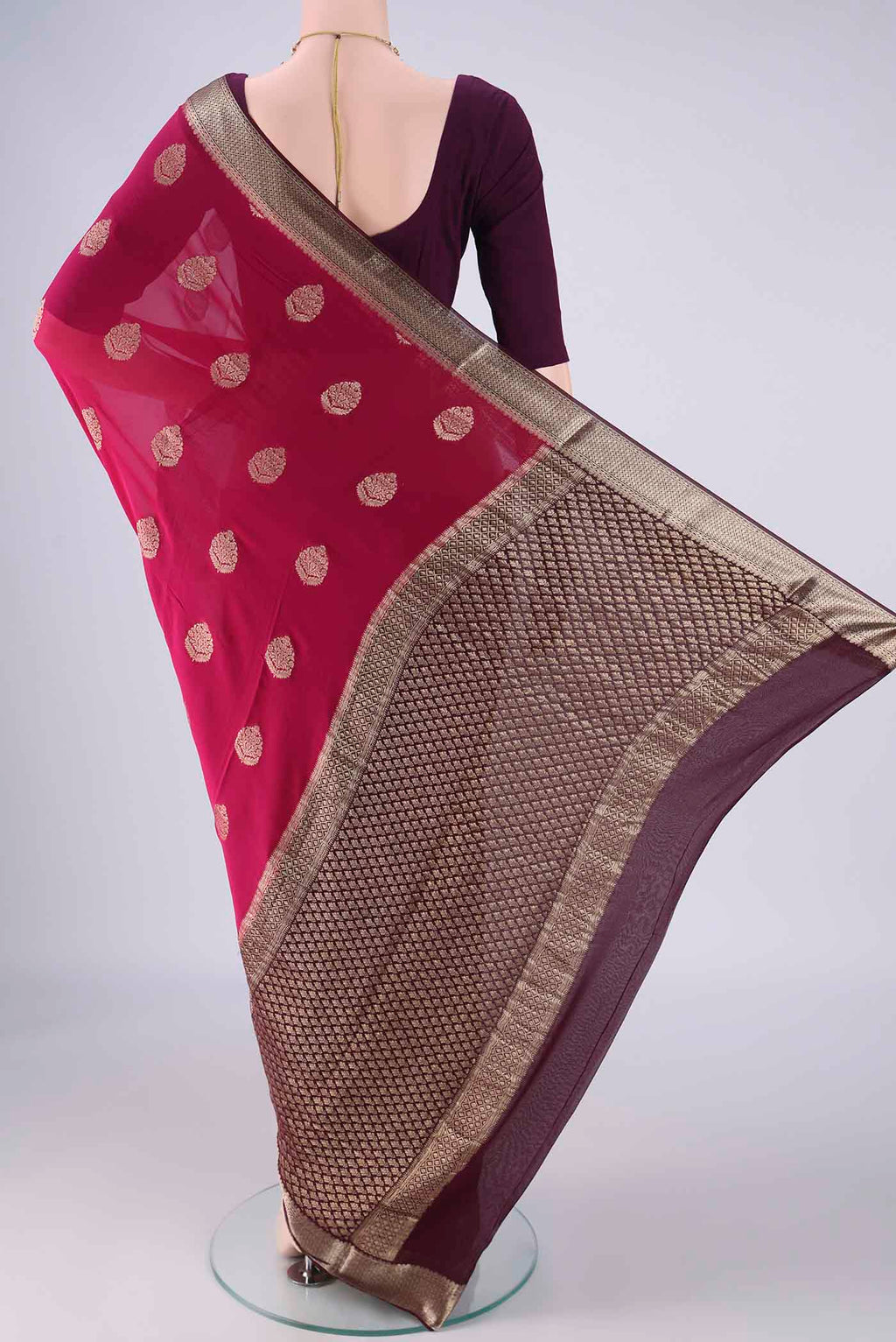 Flat view of Pink Mysore Georgette Saree with Zari Butta on the body and Zari Border. 