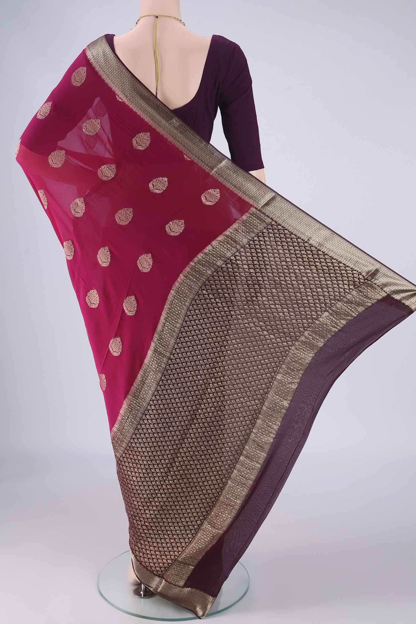 Flat view of Pink Mysore Georgette Saree with Zari Butta on the body and Zari Border. 