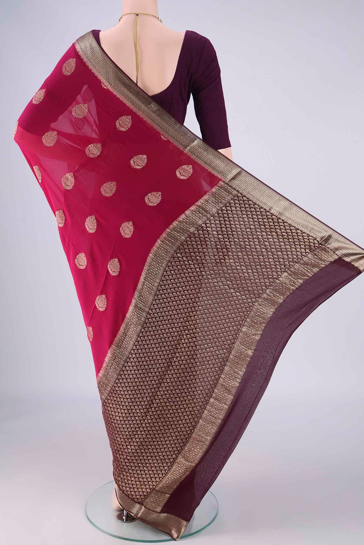 Flat view of Pink Mysore Georgette Saree with Zari Butta on the body and Zari Border. 