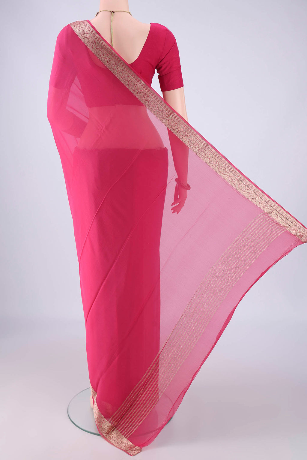 Flat view of Pink Mysore Georgette Saree with Plain Body and Zari Border. 
