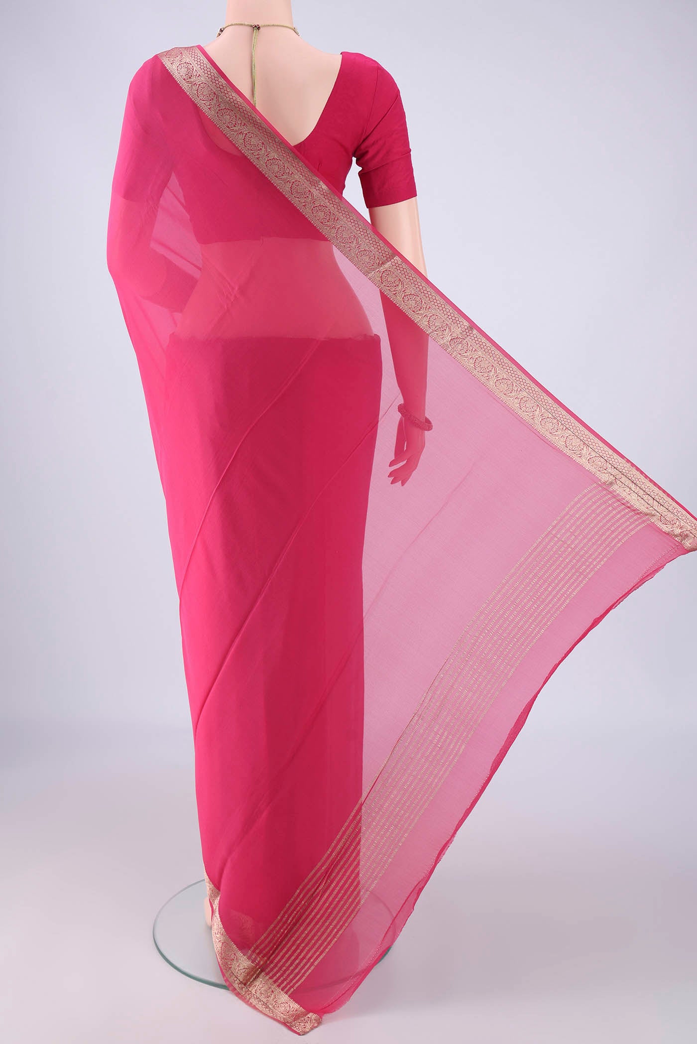 Flat view of Pink Mysore Georgette Saree with Plain Body and Zari Border. 