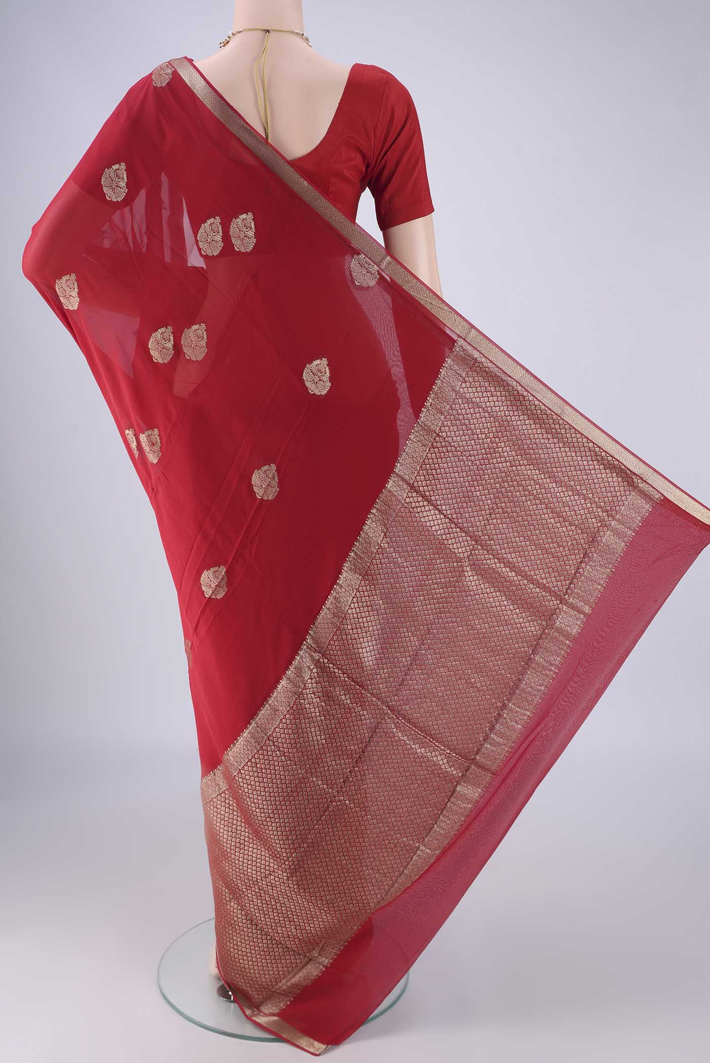 Flat view of Red Mysore Georgette Saree with Zari Butta on the body and Zari Border. 