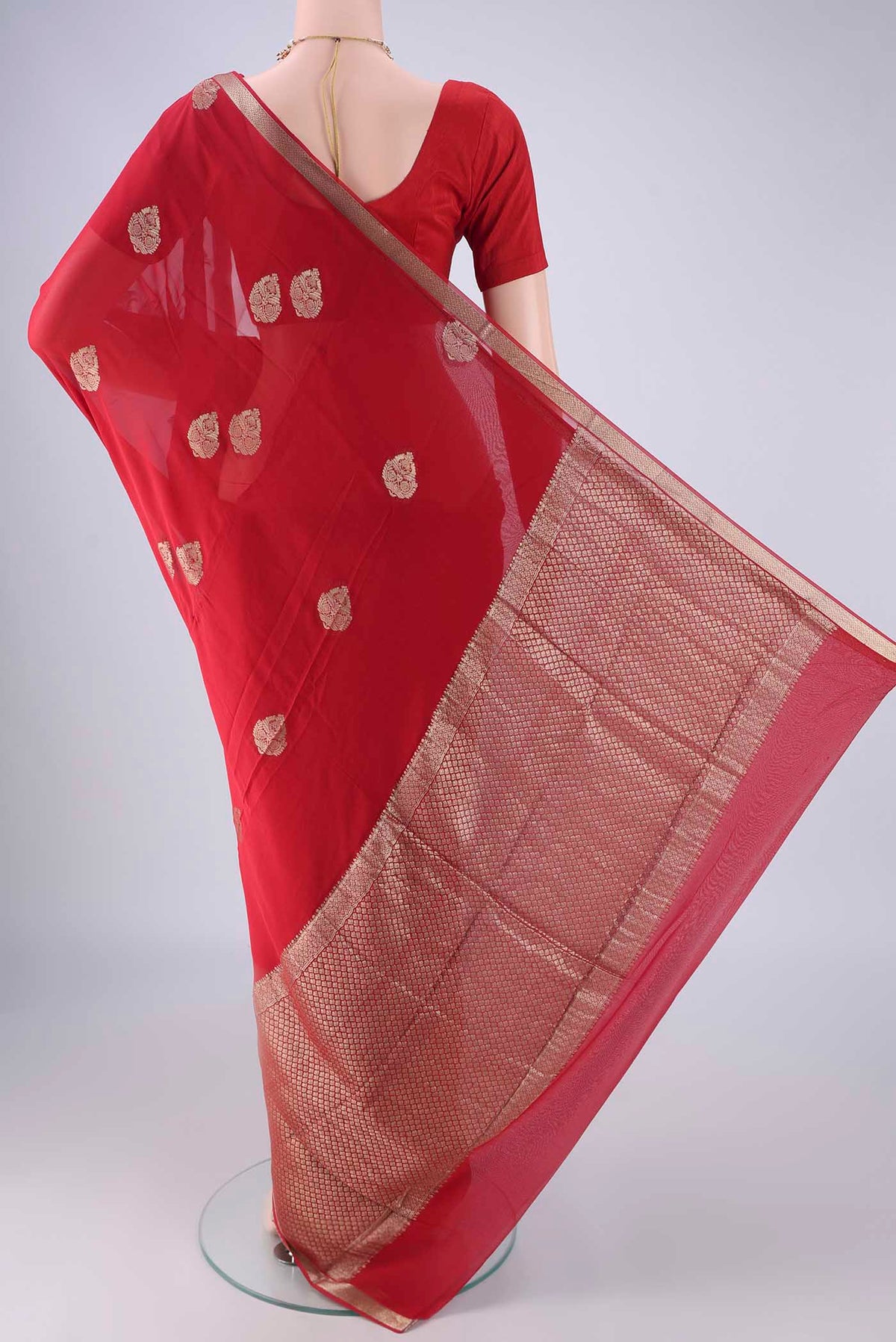 Flat view of Red Mysore Georgette Saree with Zari Butta on the body and Zari Border. 