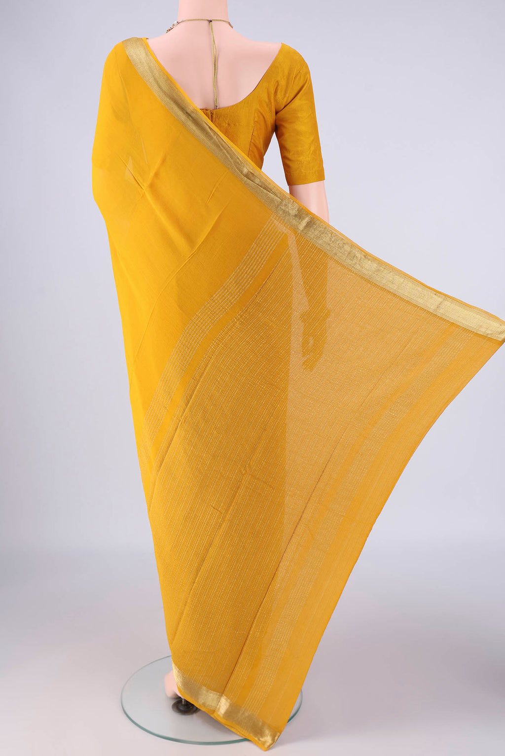 Flat view of Yellow Mysore Georgette Saree with Plain Body and Zari Border. 