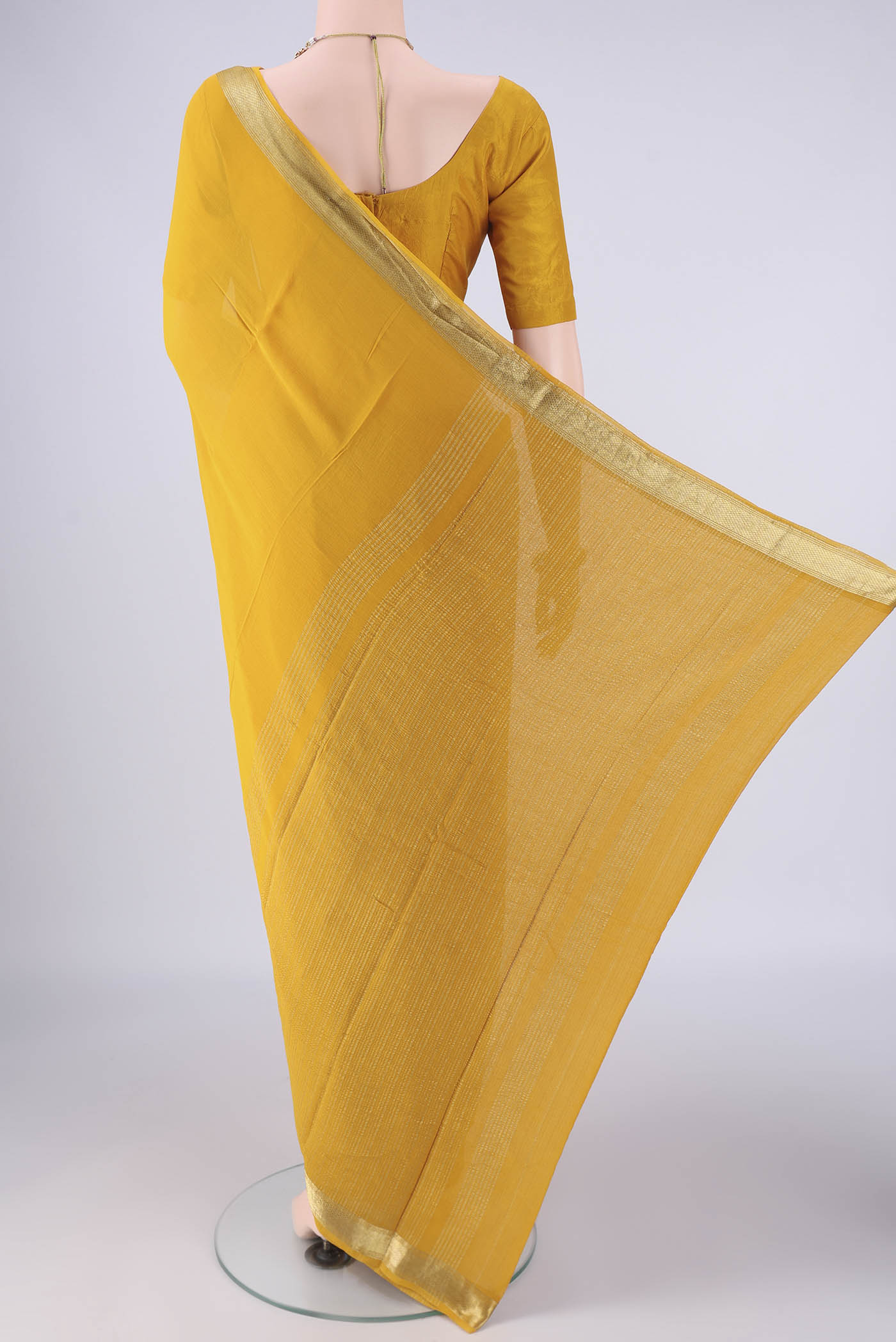 Flat view of Yellow Mysore Georgette Saree with Plain Body and Zari Border. 