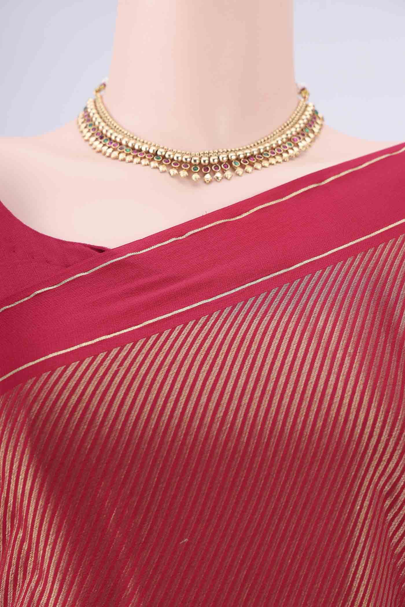 Border image of Rani Pink Mysore Crepe Saree with Zari Brocade on the body and Zari Border. 