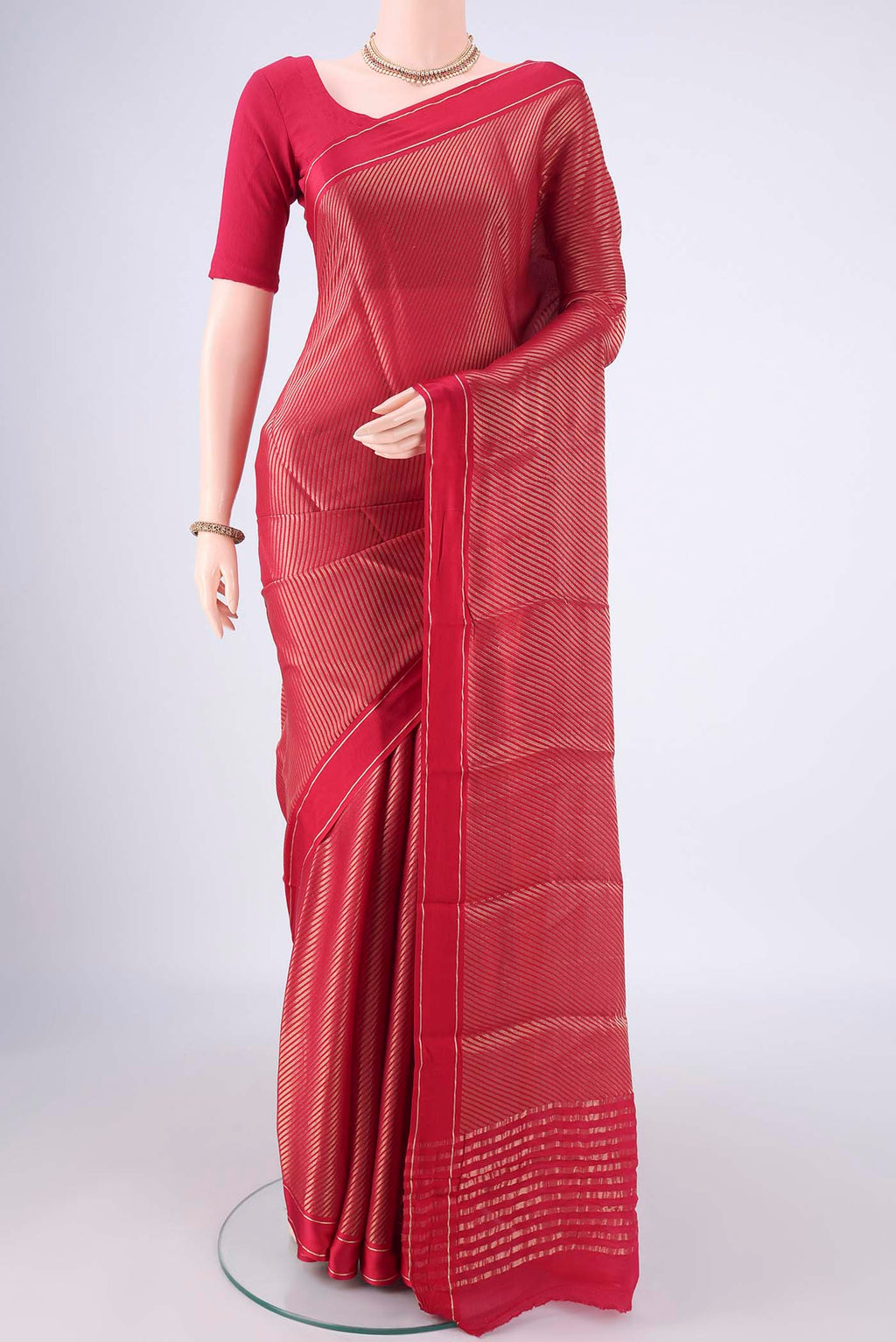 Rani Pink Mysore Crepe Saree with Zari Brocade on the body and Zari Border.  displayed on a mannequin