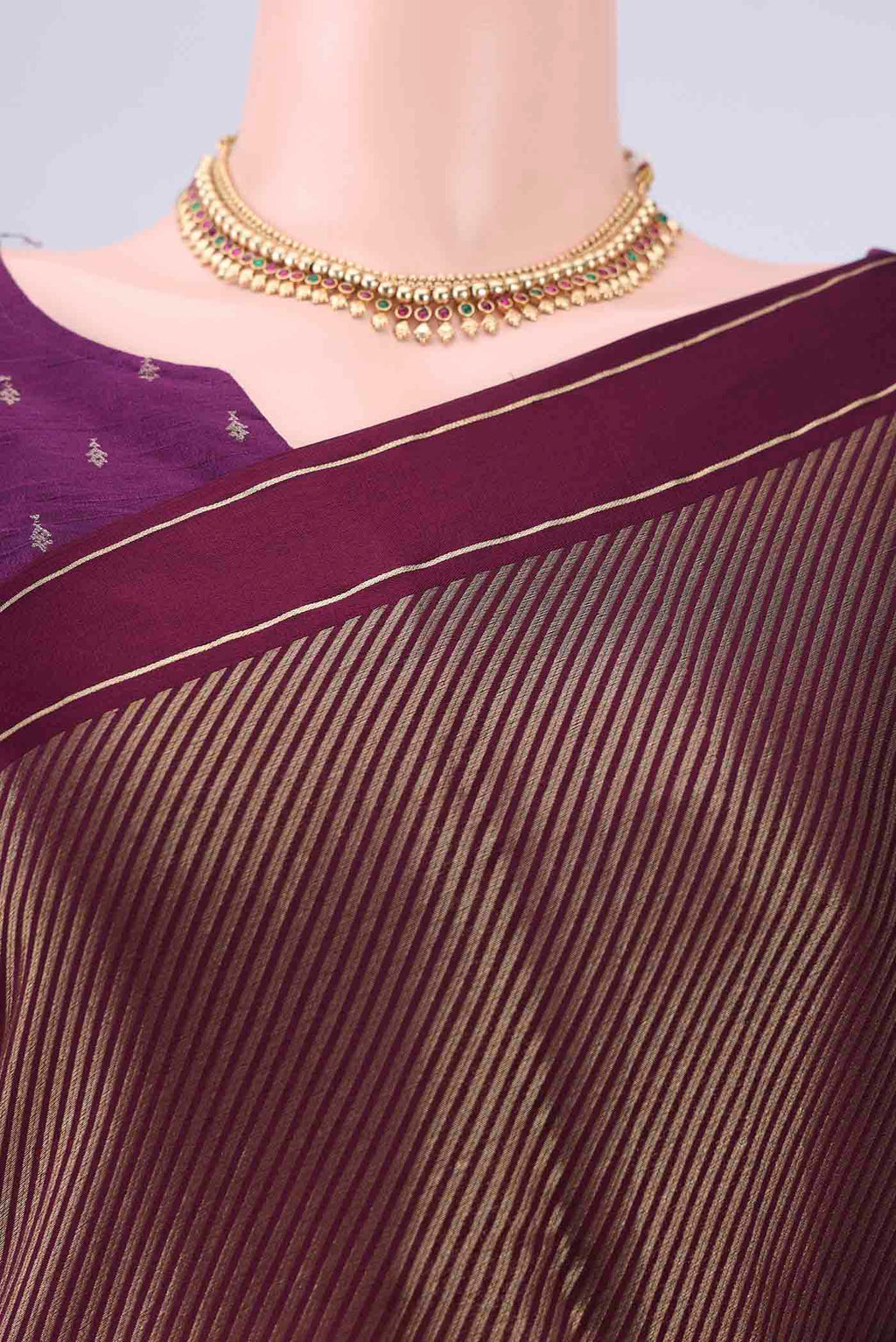 Border image of Burgundy Mysore Crepe Saree with Zari Butta on the body and Thin Zari Line. 