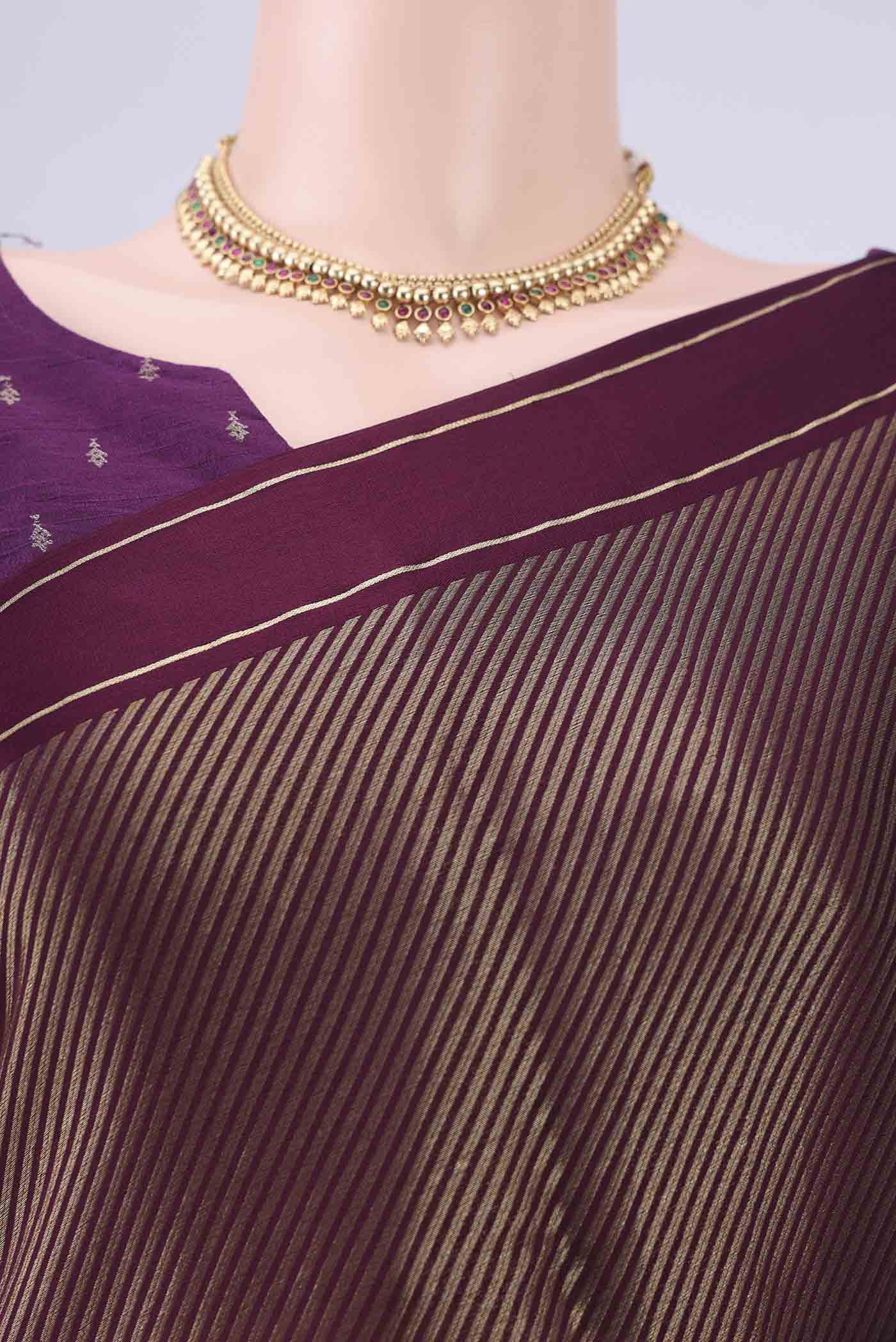 Border image of Burgundy Mysore Crepe Saree with Zari Butta on the body and Thin Zari Line. 
