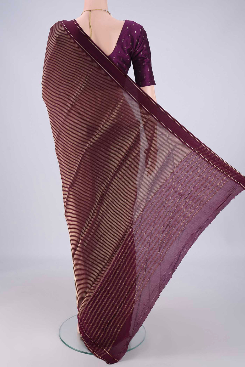 Flat view of Burgundy Mysore Crepe Saree with Zari Butta on the body and Thin Zari Line. 