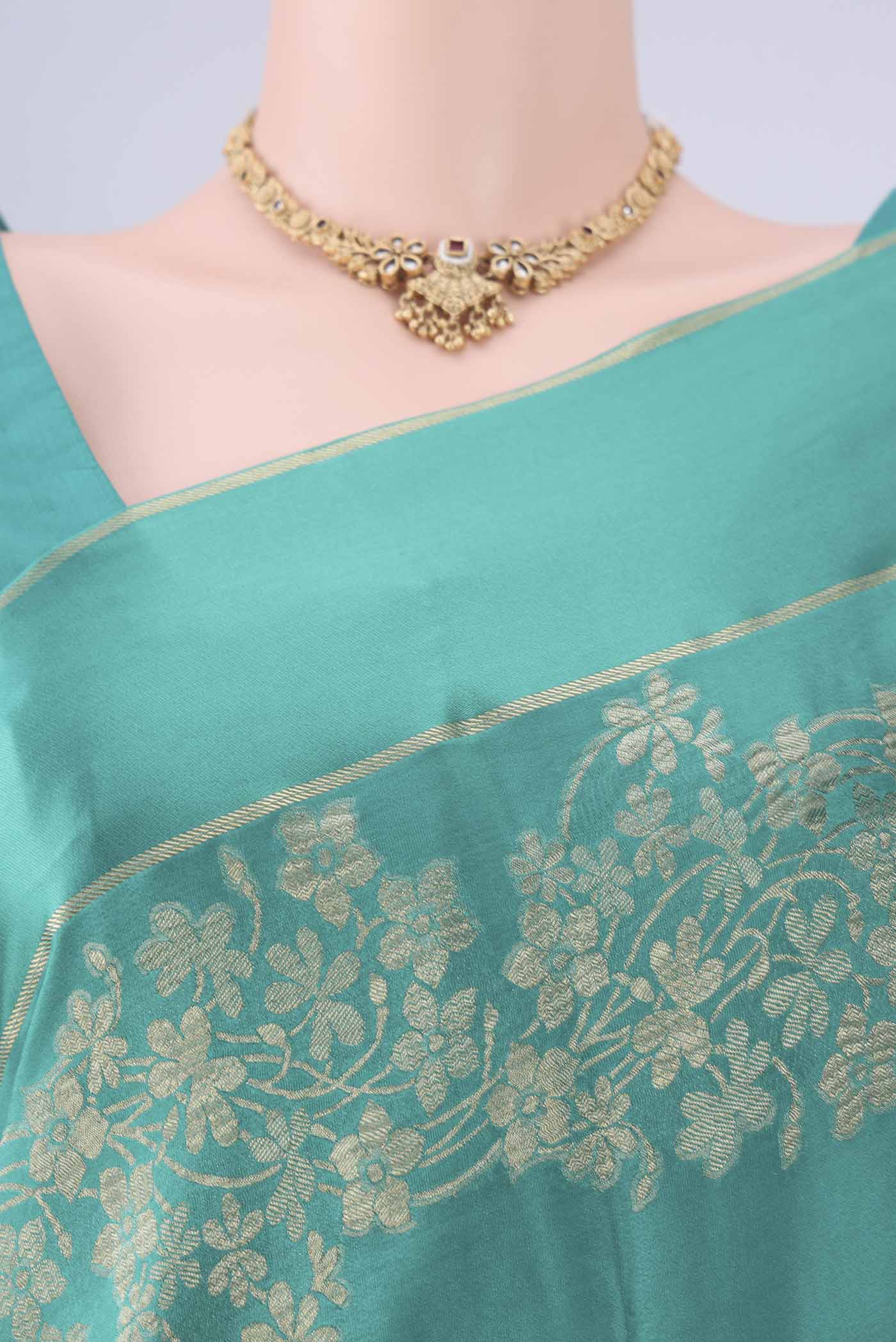 Border image of Sea Green Mysore Crepe Saree with Zari Butta on the body and Thin Zari Line. 