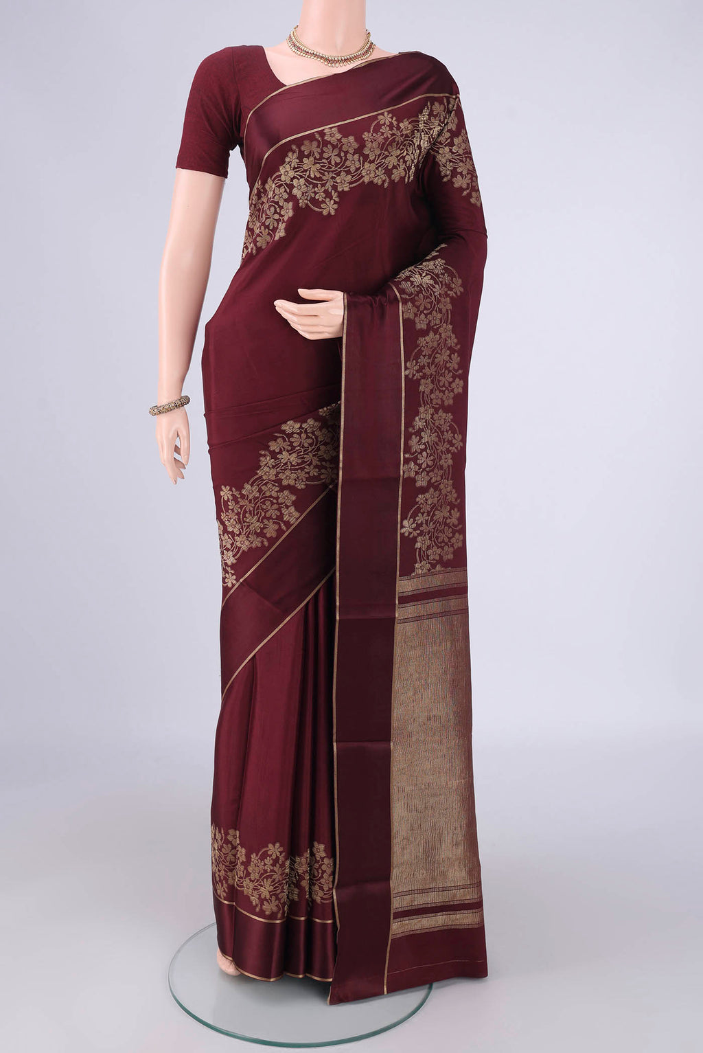 Maroon Mysore Crepe Saree with Plain Body and Zari Border.  displayed on a mannequin