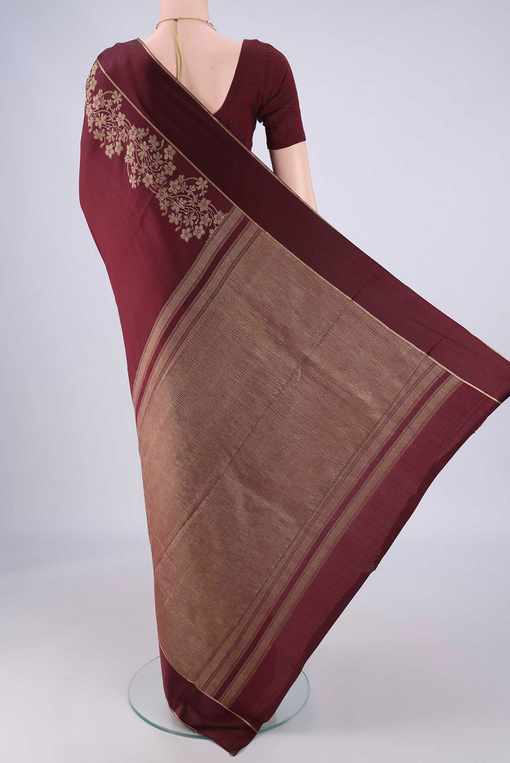 Flat view of Maroon Mysore Crepe Saree with Plain Body and Zari Border. 
