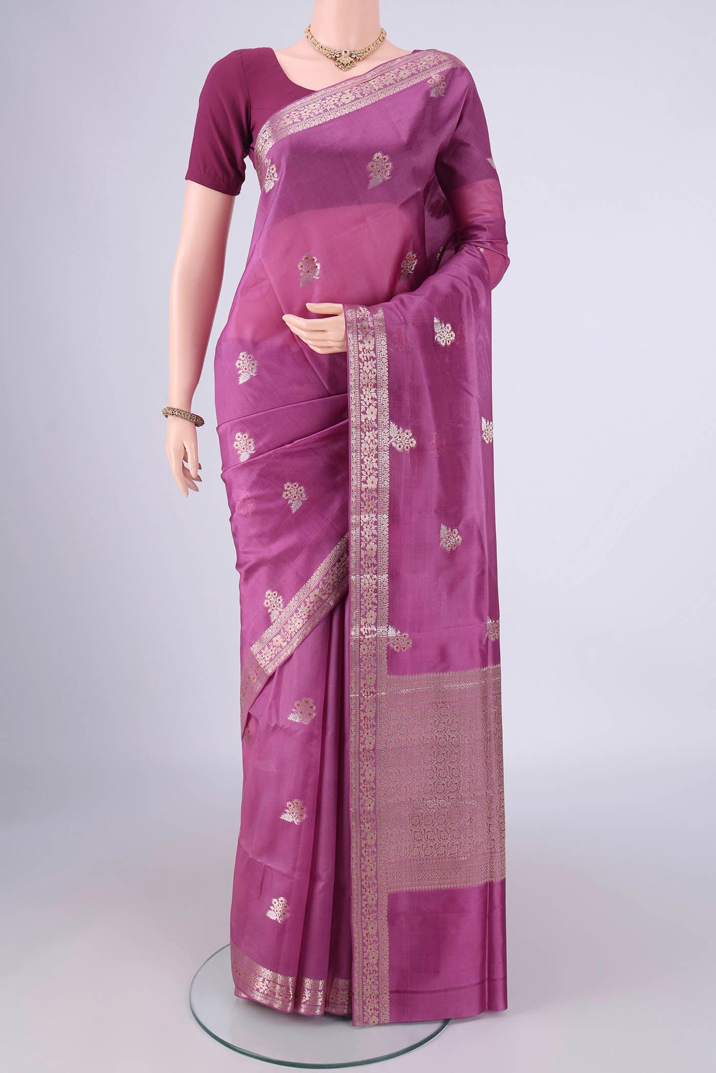 Purple Banarasi Raw Silk Saree with Zari And Thread Butta on the body and Zari And Thread Border.  displayed on a mannequin