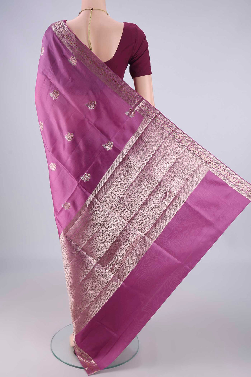 Flat view of Purple Banarasi Raw Silk Saree with Zari And Thread Butta on the body and Zari And Thread Border. 