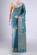 Maya Blue Banarasi Raw Silk Saree with Zari Butta on the body and Zari Border.  displayed on a mannequin