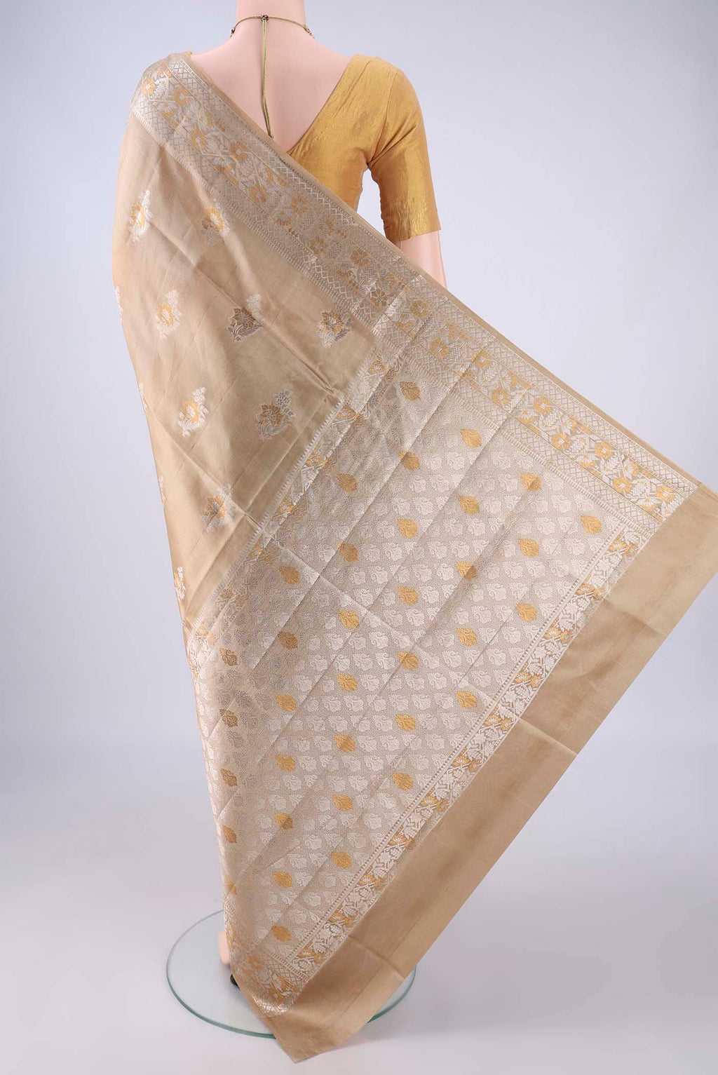 Flat view of Dark Beige Banarasi Raw Silk Saree with Zari Butta on the body and Zari Border. 