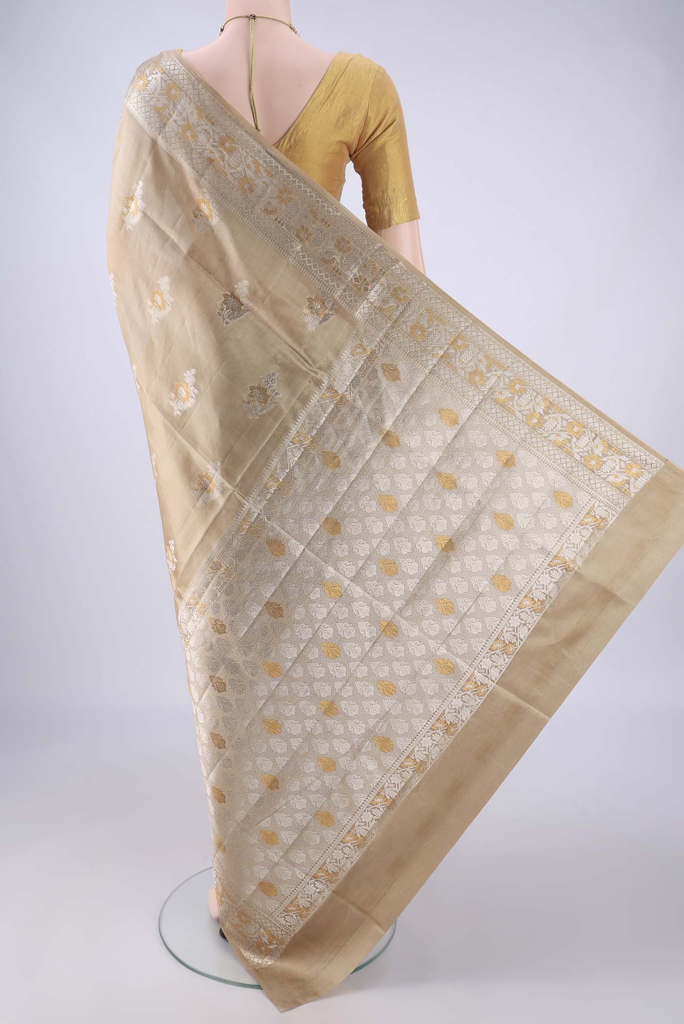 Flat view of Dark Beige Banarasi Raw Silk Saree with Zari Butta on the body and Zari Border. 