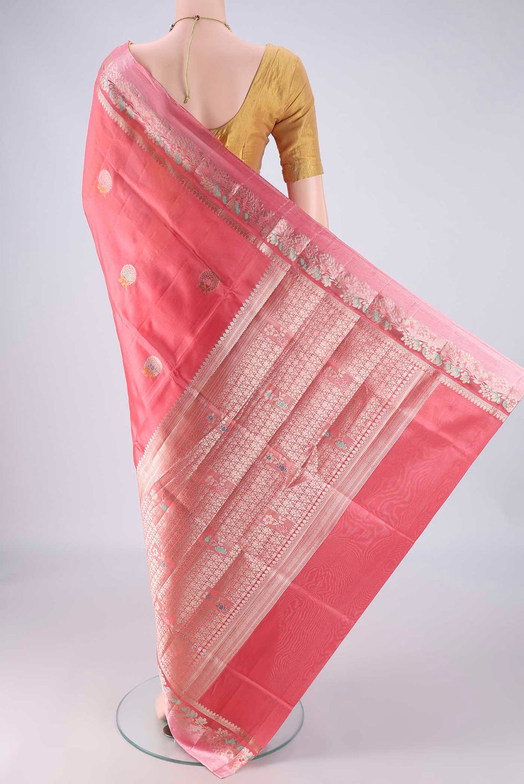 Flat view of Coral Banarasi Raw Silk Saree with Zari And Thread Butta on the body and Zari And Thread Border. 