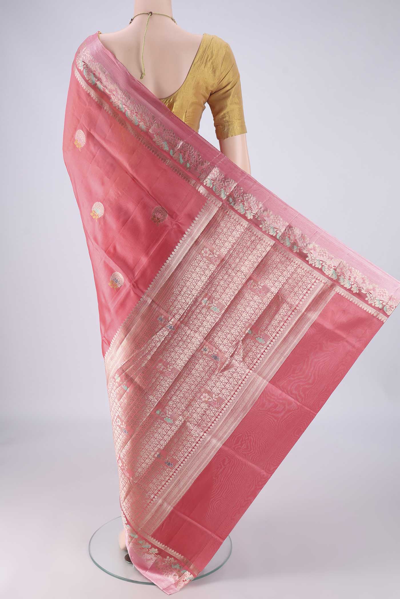 Flat view of Coral Banarasi Raw Silk Saree with Zari And Thread Butta on the body and Zari And Thread Border. 