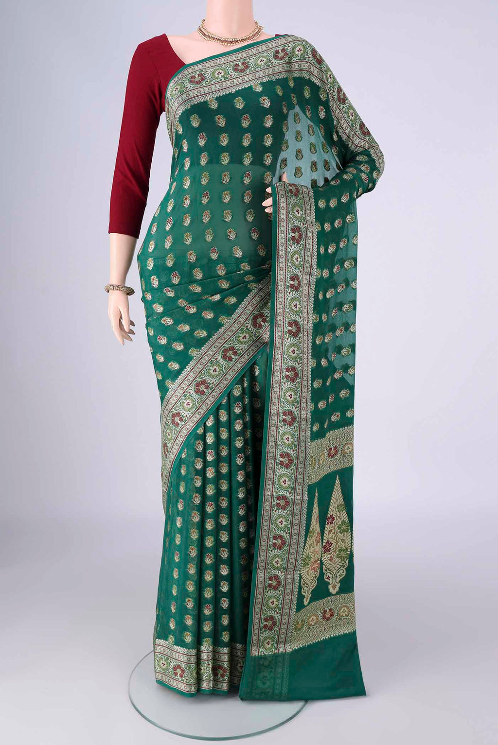 Green Blended Banarasi Georgette Saree with Zari And Thread Butta on the body and Zari And Thread Border.  displayed on a mannequin