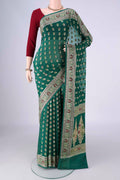 Green Blended Banarasi Georgette Saree with Zari And Thread Butta on the body and Zari And Thread Border.  displayed on a mannequin
