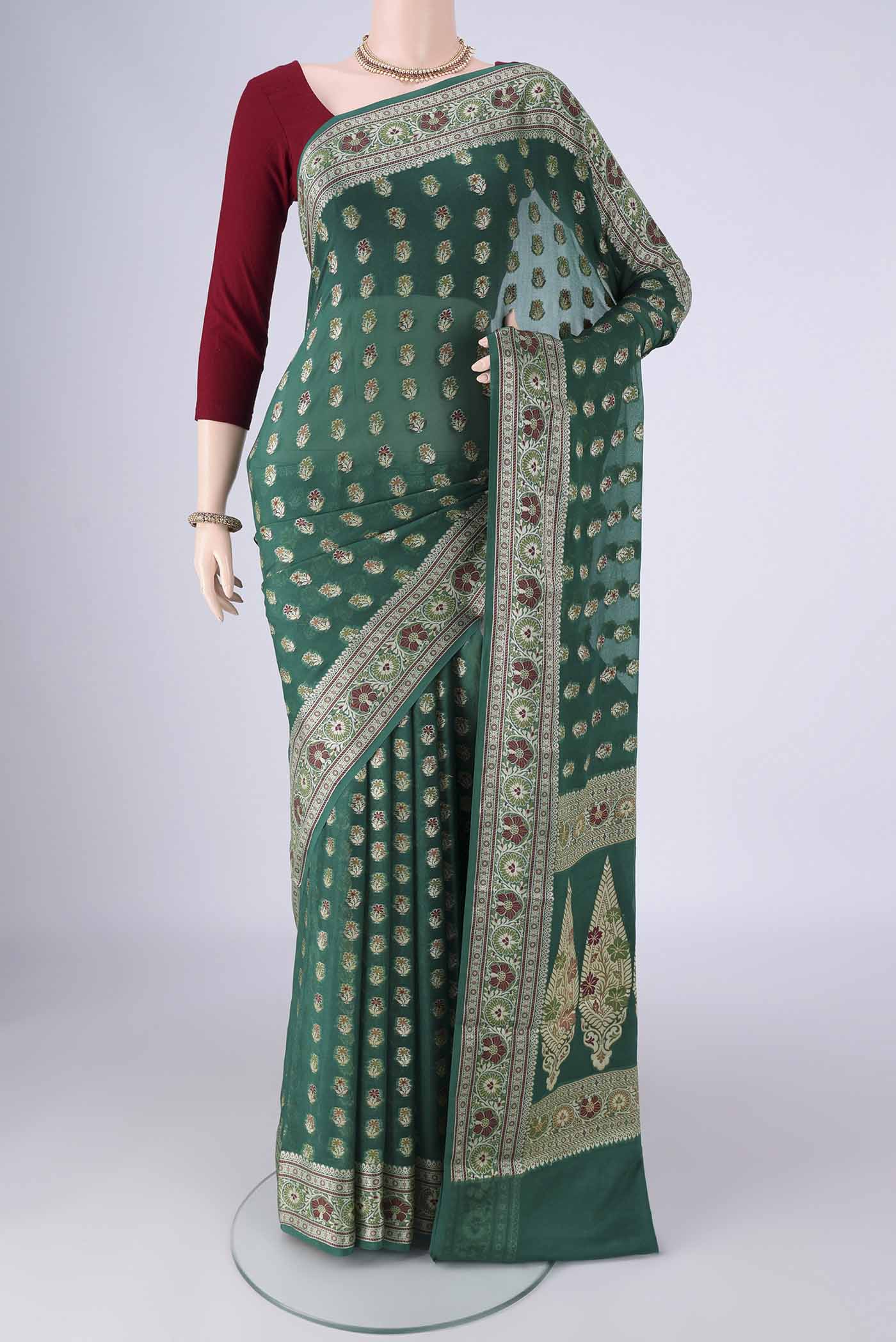 Green Blended Banarasi Georgette Saree with Zari And Thread Butta on the body and Zari And Thread Border.  displayed on a mannequin