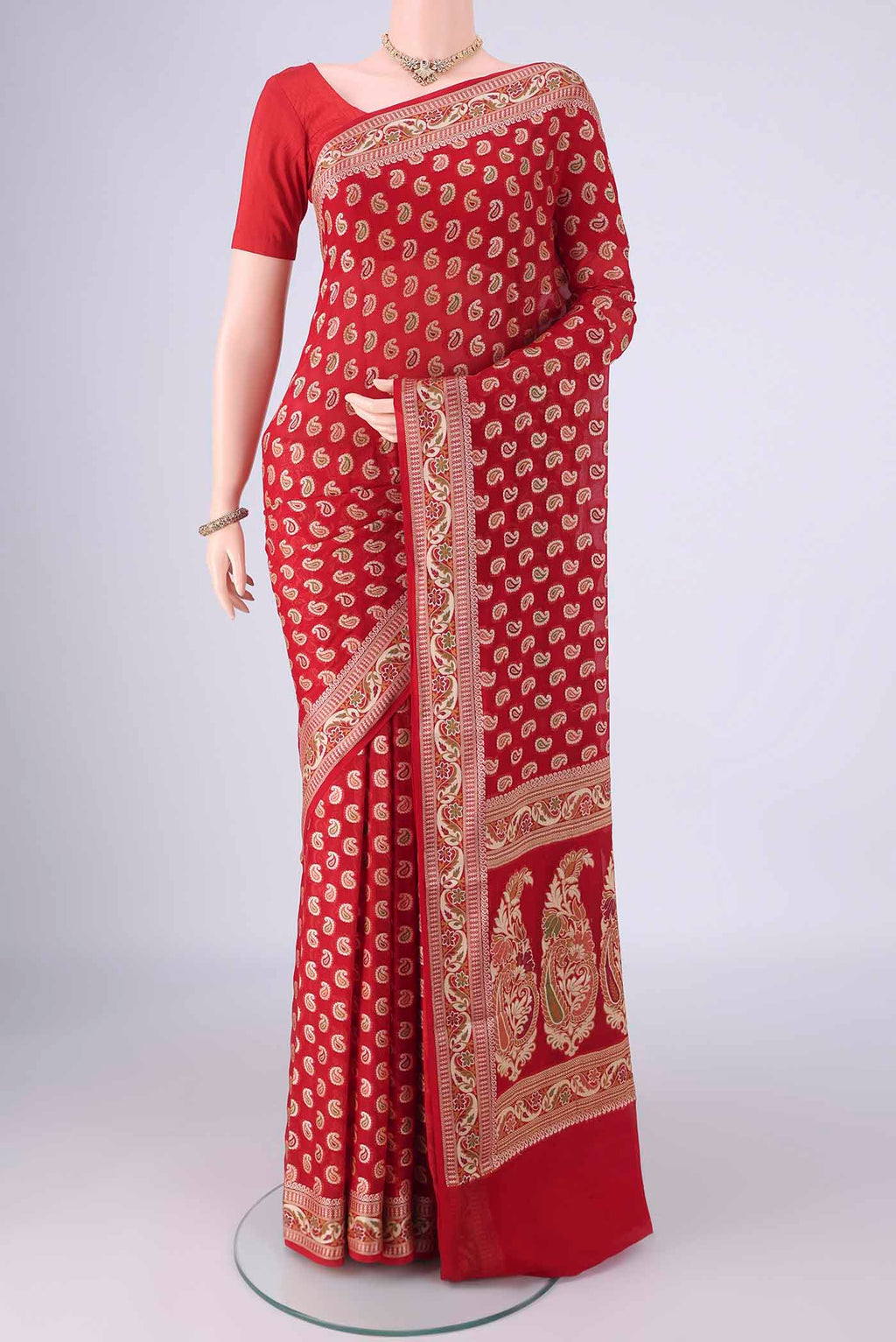 Red Blended Banarasi Georgette Saree with Thread Butta on the body and Zari And Thread Border.  displayed on a mannequin