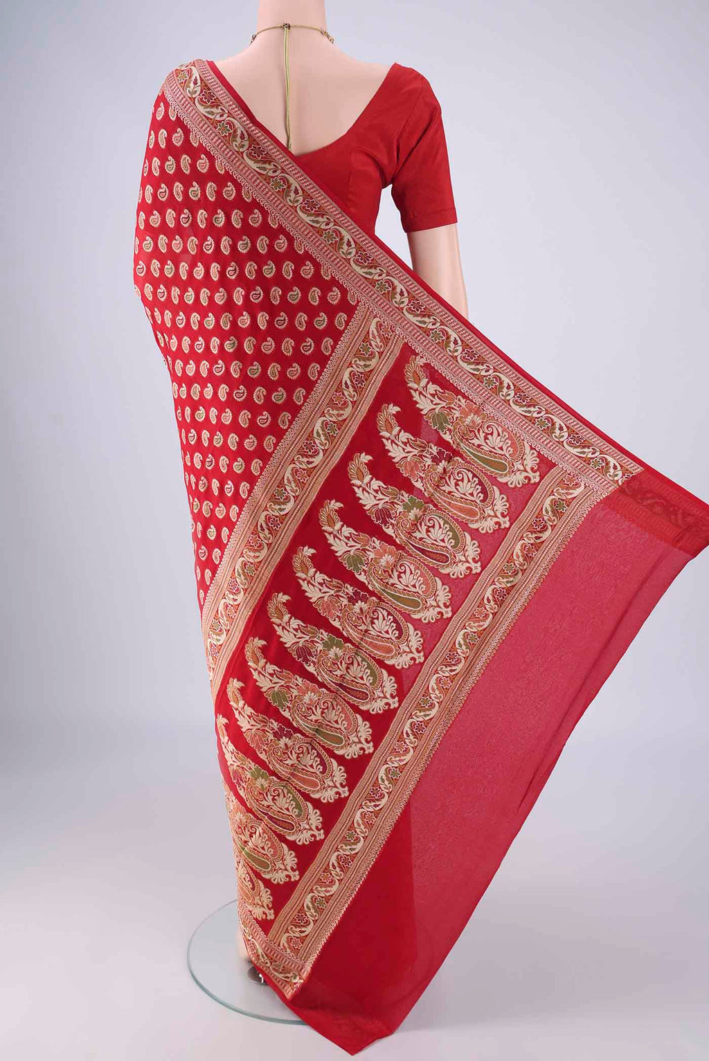 Flat view of Red Blended Banarasi Georgette Saree with Thread Butta on the body and Zari And Thread Border. 