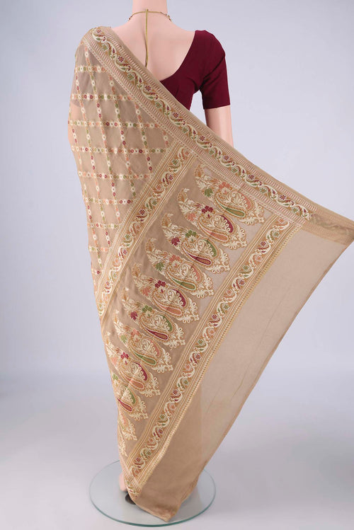 Flat view of Beige Blended Banarasi Georgette Saree with Thread Brocade on the body and Zari And Thread Border. 