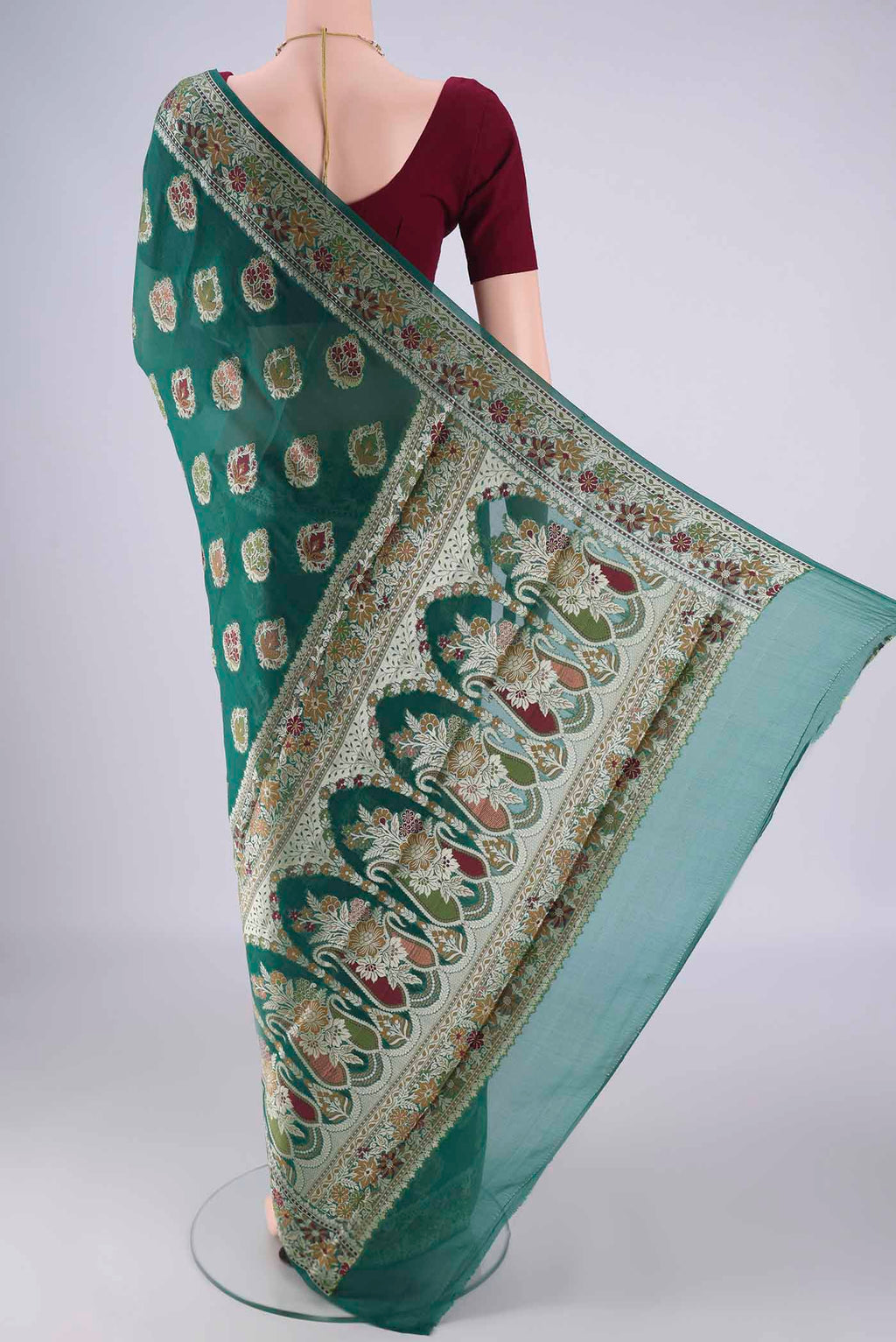 Flat view of Teal Blended Banarasi Georgette Saree with Thread Butta on the body and Zari And Thread Border. 