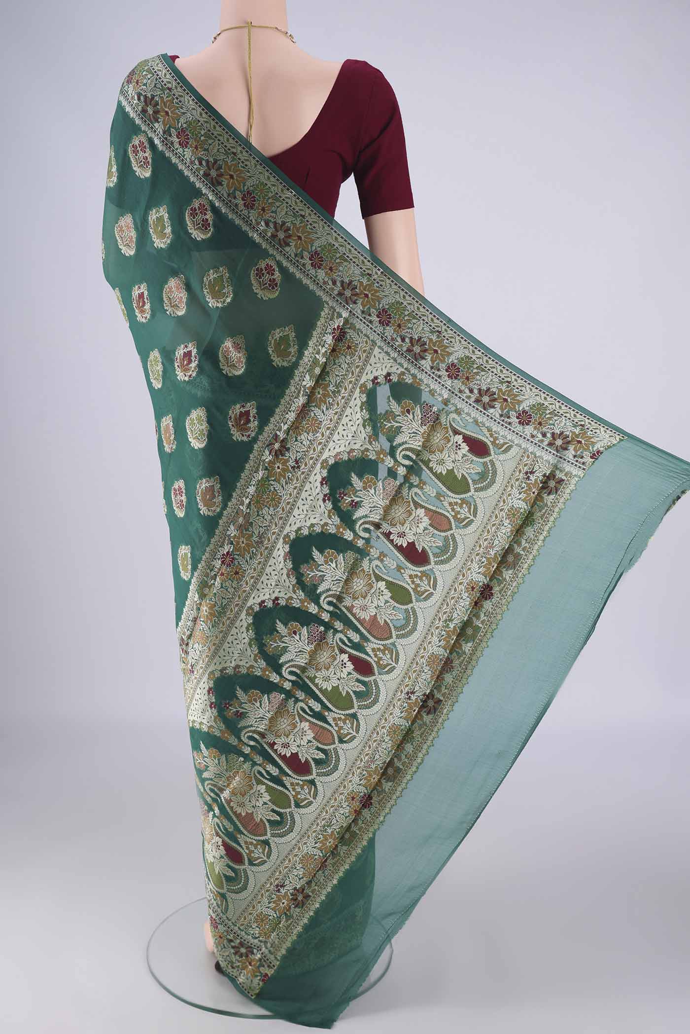 Flat view of Teal Blended Banarasi Georgette Saree with Thread Butta on the body and Zari And Thread Border. 